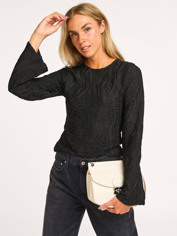 Ontdek de Freddie geweven top met structuur van Co'Couture in de kleur zwart bij Orangebag. Op werkdagen voor 21:45 besteld, morgen in huis.