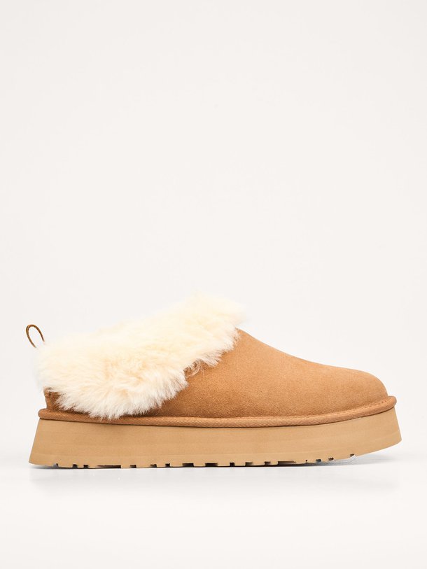 Ontdek de Tazelle suède instappers van Ugg in de kleur bruin bij Orangebag. Op werkdagen voor 21:45 besteld, morgen in huis.