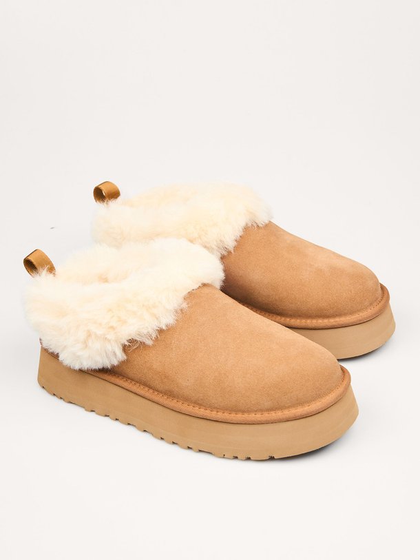 Ontdek de Tazelle suède instappers van Ugg in de kleur bruin bij Orangebag. Op werkdagen voor 21:45 besteld, morgen in huis.