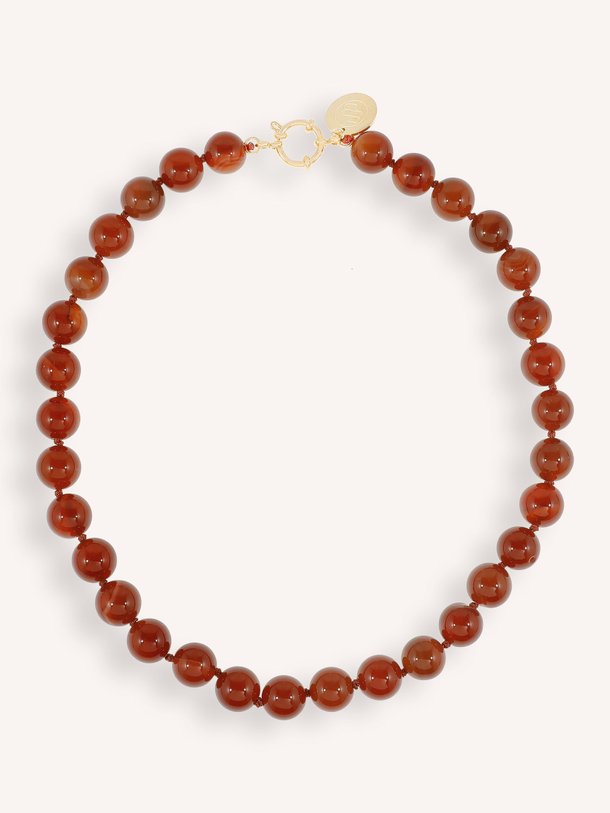 Ontdek de Vergulde halsketting met kralen van Ellen Beekmans in de kleur cognac bij Orangebag. Op werkdagen voor 21:45 besteld, morgen in huis.