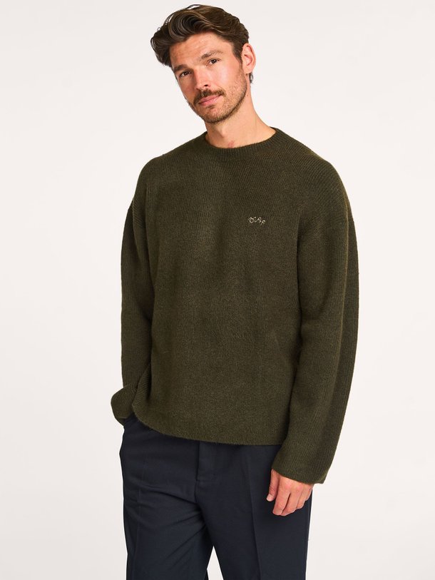 Ontdek de Wolmix trui van OLAF in de kleur donkergroen bij Orangebag. Op werkdagen voor 21:45 besteld, morgen in huis.