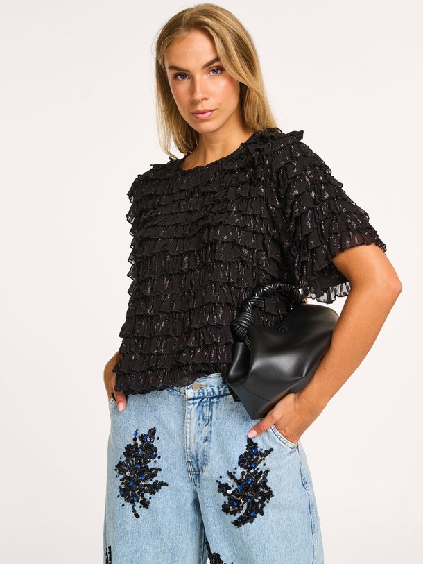 Ontdek de Incarvillea viscose top met lurex van Essentiel Antwerp in de kleur zwart bij Orangebag. Op werkdagen voor 21:45 besteld, morgen in huis.