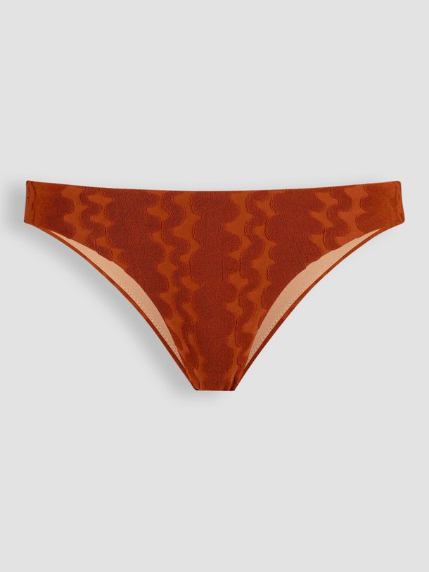 Ontdek de Bikinislip met dessin van OAS in de kleur terracotta bij Orangebag. Op werkdagen voor 21:45 besteld, morgen in huis.
