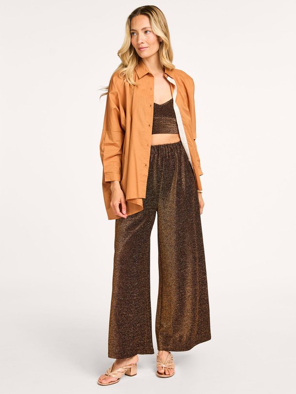 Ontdek de Disco fijngebreide lurex broek van Karma Koma in de kleur brons bij Orangebag. Op werkdagen voor 21:45 besteld, morgen in huis.
