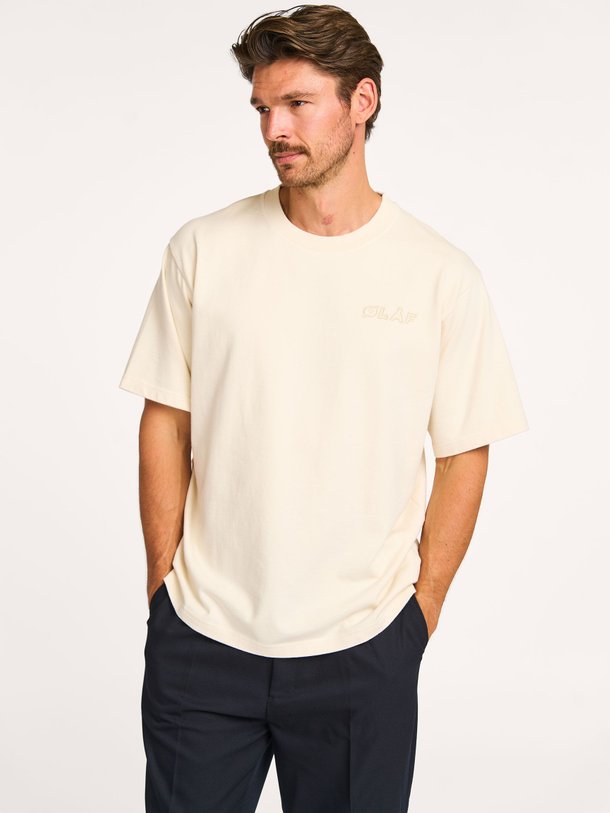 Ontdek de Studio Tee katoenen T-shirt met logo van OLAF in de kleur off-white bij Orangebag. Op werkdagen voor 21:45 besteld, morgen in huis.