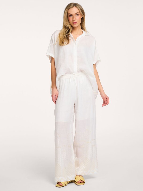 Ontdek de Ramie broek met borduursel van Greek Archaic Kori in de kleur Wit bij Orangebag. Op werkdagen voor 21:45 besteld, morgen in huis.