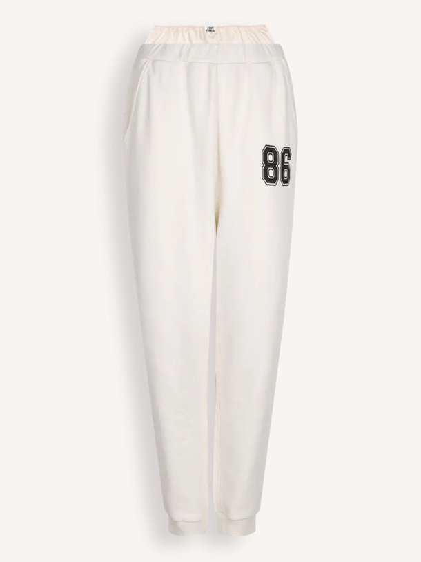 Love Stories Donna - Katoenen Joggingsbroek - Off-White Ontdek de Donna katoenen joggingsbroek van Love Stories in de kleur off-white bij Orangebag. Op werkdagen voor 21:45 besteld, morgen in huis.