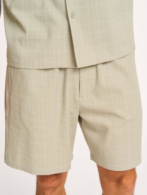 Ontdek de Geweven short met dessin van OLAF in de kleur lichtgroen bij Orangebag. Op werkdagen voor 21:45 besteld, morgen in huis.