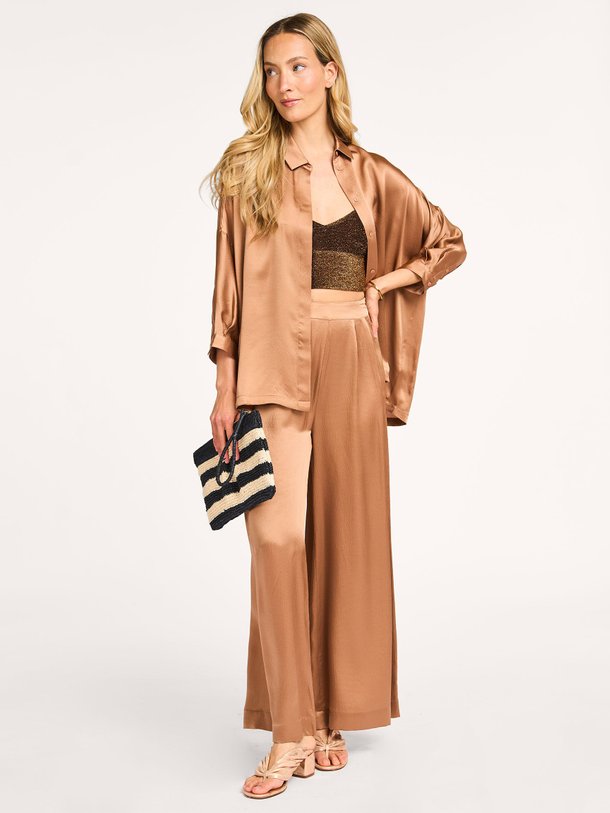 Ontdek de Swan zijden broek van Karma Koma in de kleur koper bij Orangebag. Op werkdagen voor 21:45 besteld, morgen in huis.