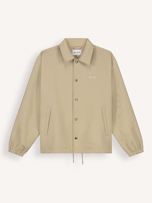 Ontdek de Coach geweven logo jack van OLAF in de kleur beige bij Orangebag. Op werkdagen voor 21:45 besteld, morgen in huis.