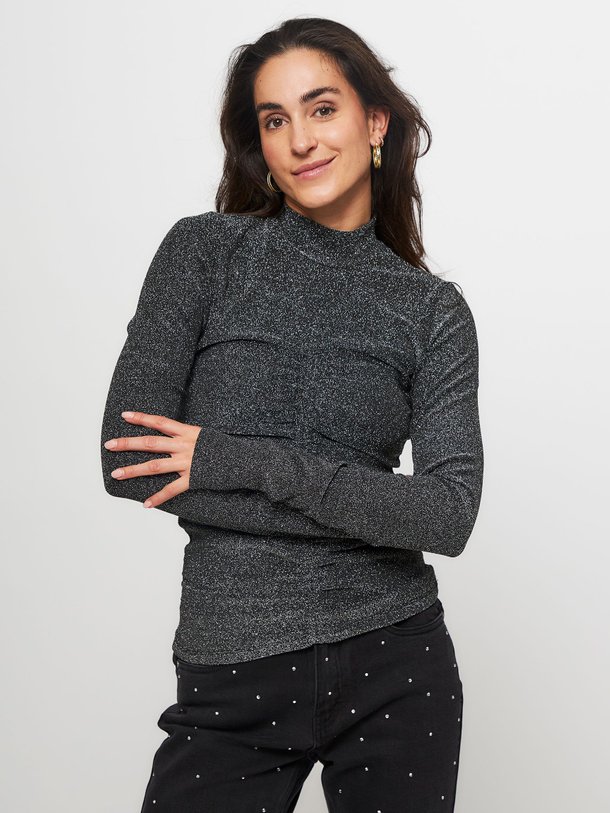 Ontdek de Eliza jersey top met lurex van Freebird in de kleur zwart bij Orangebag. Op werkdagen voor 21:45 besteld, morgen in huis.