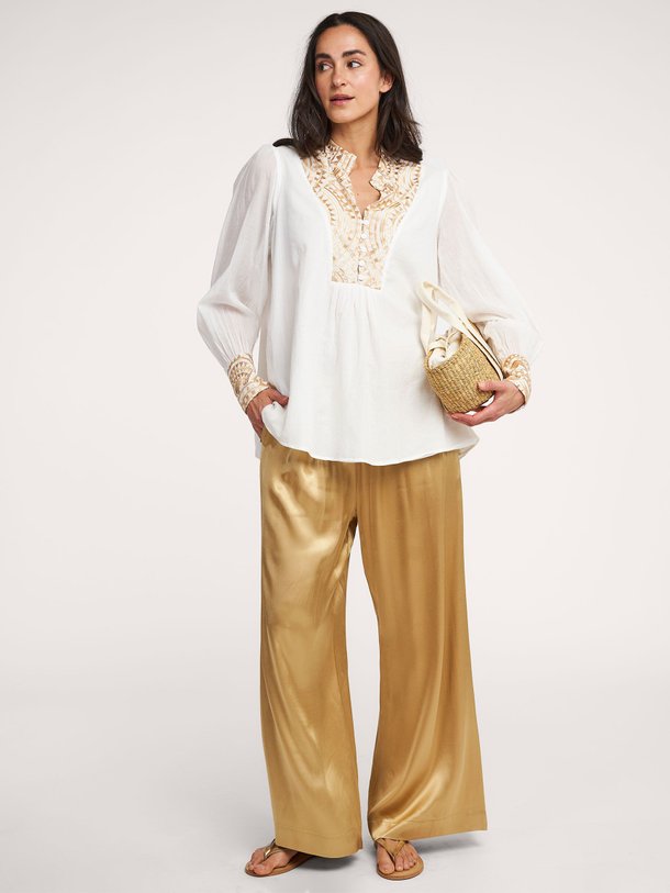 Ontdek de Viscose glanzende wide leg broek van Greek Archaic Kori in de kleur goudkleur bij Orangebag. Op werkdagen voor 21:45 besteld, morgen in huis.