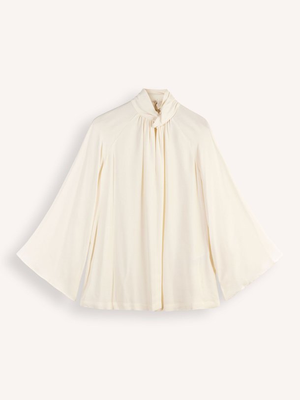 Ontdek de Viscose top met knoopdetail van Semicouture in de kleur crème bij Orangebag. Op werkdagen voor 21:45 besteld, morgen in huis.