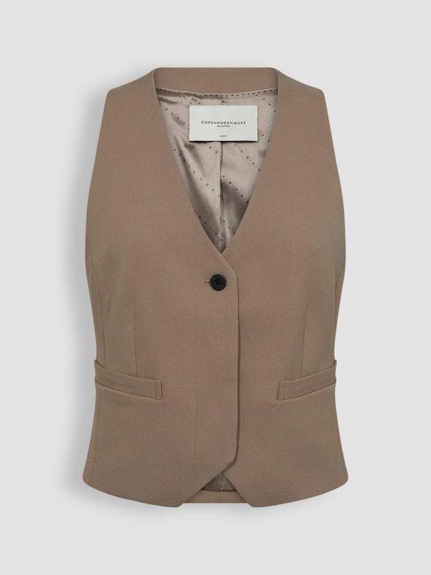 Ontdek de Tailor viscosemix gilet van Copenhagen Muse in de kleur lichtbruin bij Orangebag. Op werkdagen voor 21:45 besteld, morgen in huis.
