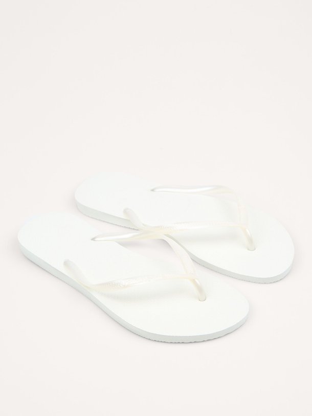 Ontdek de Slim teenslippers van Havaianas in de kleur wit bij Orangebag. Op werkdagen voor 21:45 besteld, morgen in huis.
