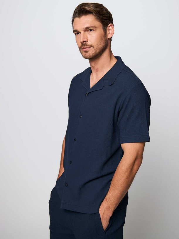 Ontdek de Powell katoenen polo met structuur van Boss in de kleur donkerblauw bij Orangebag. Op werkdagen voor 21:45 besteld, morgen in huis.