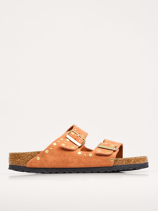 Ontdek de Arizona Rivet suède slippers met studs van Birkenstock in de kleur terracotta bij Orangebag. Op werkdagen voor 21:45 besteld, morgen in huis.