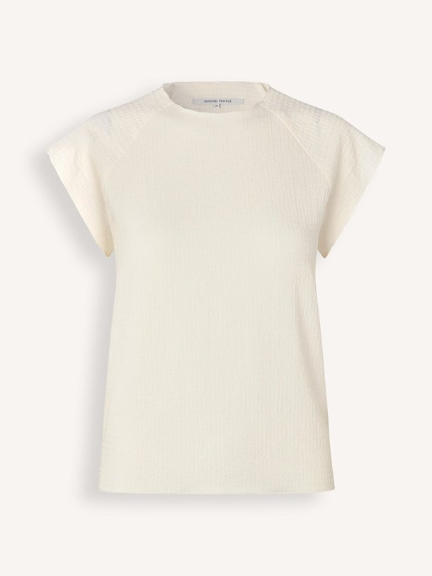 Ontdek de Paria jersey top met wafelstructuur van Second Female in de kleur Off-white bij Orangebag. Op werkdagen voor 21:45 besteld, morgen in huis.