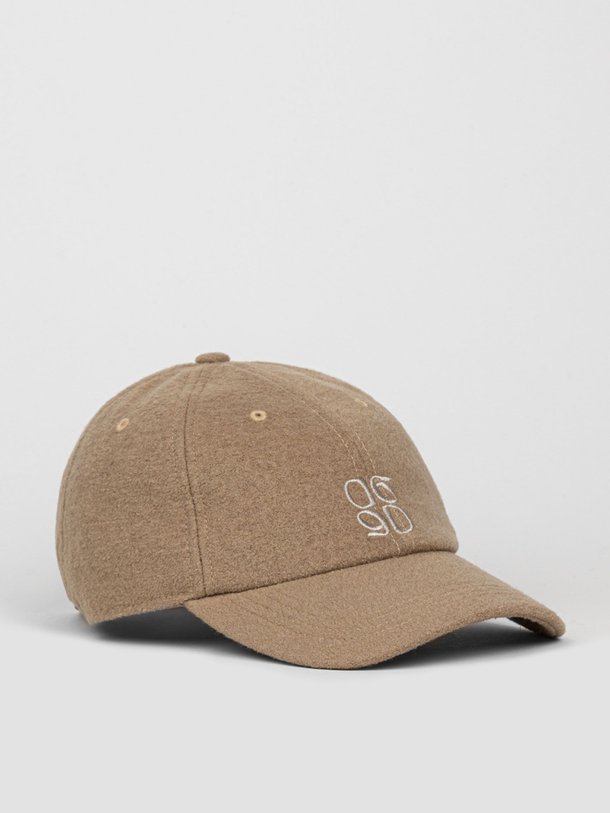 Ontdek de Fall wolmix bouclé logo pet van Dante 6 in de kleur taupe bij Orangebag. Op werkdagen voor 21:45 besteld, morgen in huis.