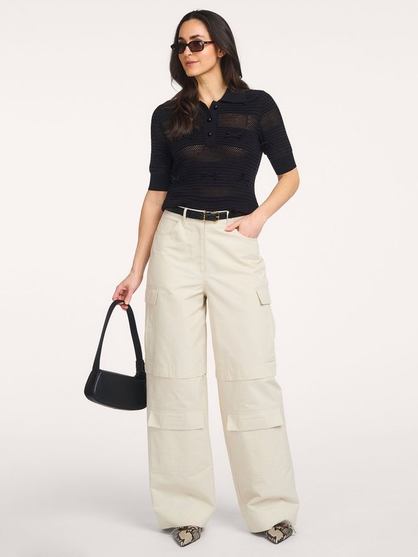 Ontdek de Jarts viscosemix polo top van Essentiel Antwerp in de kleur Zwart bij Orangebag. Op werkdagen voor 21:45 besteld, morgen in huis.