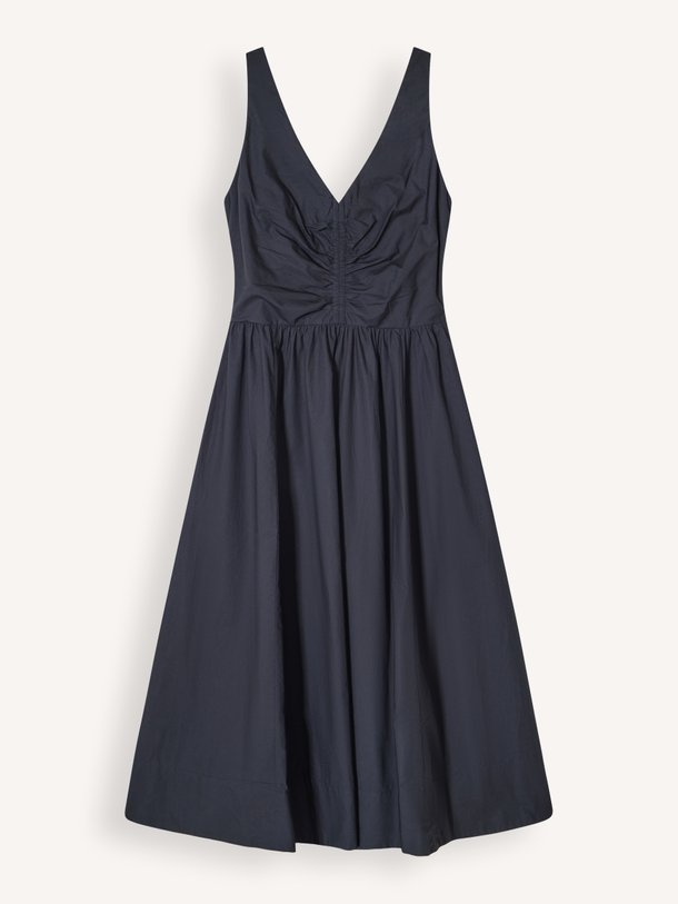 Ontdek de tijdloze Xirena Patrice Dress in klassiek zwart. Deze mouwloze katoenen jurk met V-hals en zwierige rok is perfect voor elke zomerse dag.