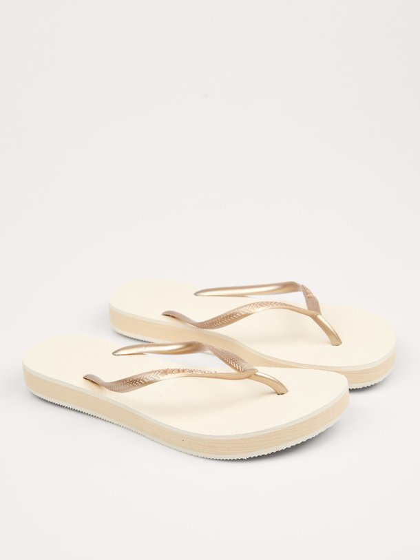 Ontdek de Slim Flatform teenslippers van Havaianas in de kleur beige bij Orangebag. Op werkdagen voor 21:45 besteld, morgen in huis.