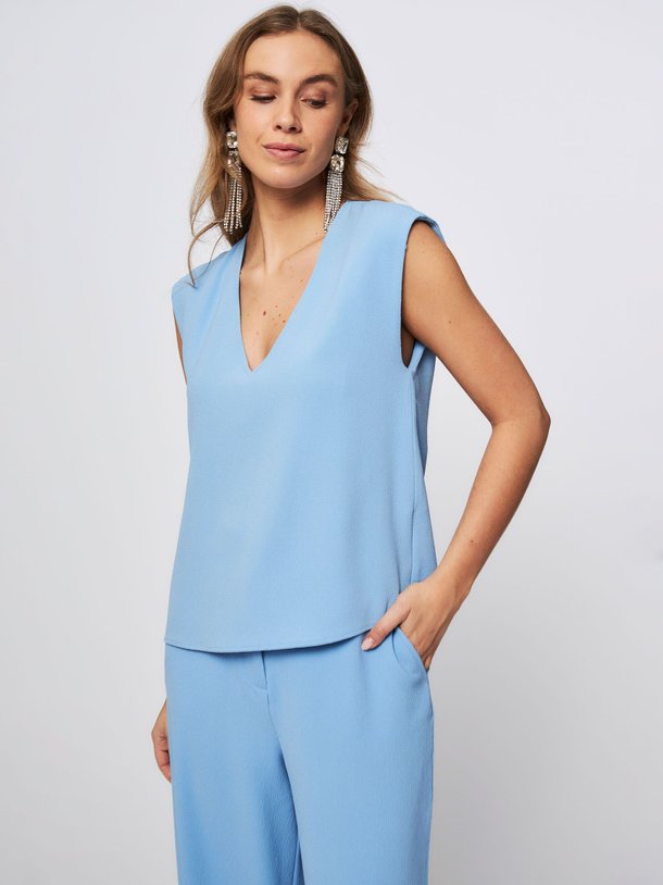 Ontdek de Falling geweven top van Essentiel Antwerp in de kleur blauw bij Orangebag. Op werkdagen voor 21:45 besteld, morgen in huis.