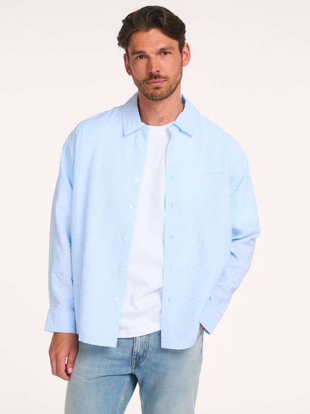 Ontdek de Fleur katoenmix gestreept seersucker overhemd van Law of the Sea in de kleur Blauw bij Orangebag. Op werkdagen voor 21:45 besteld, morgen in huis.