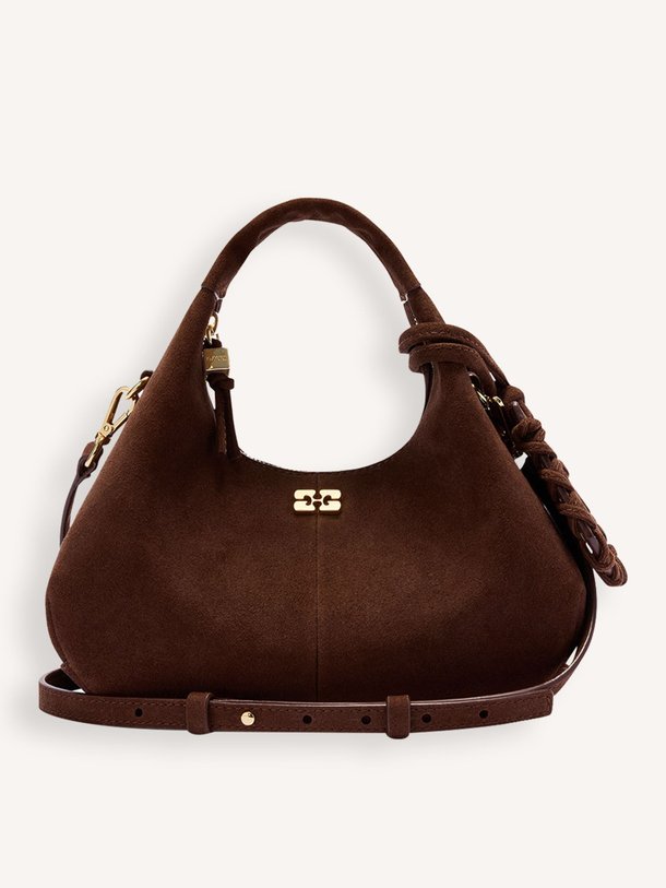 Ontdek de Hobo mini suedè schouder-/handtas van Ganni in de kleur Donkerbruin bij Orangebag. Op werkdagen voor 21:45 besteld, morgen in huis.
