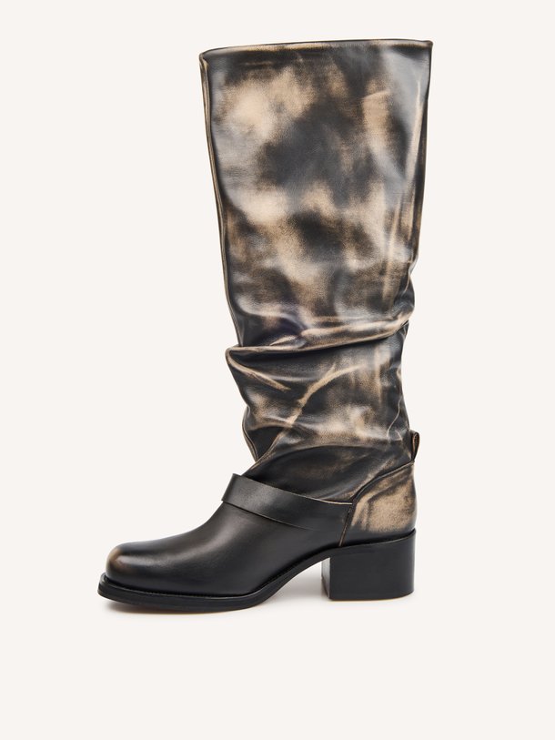 Toral CLIDE online kopen | Orangebag Ontdek de Toral CLIDE: stoere leren slouchy laarzen met een unieke metallic finish. Shop deze eyecatchers nu online bij Orangebag.